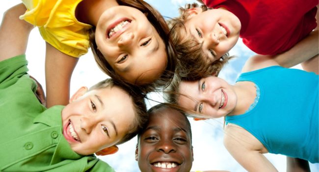 A group of diverse children playing outside.